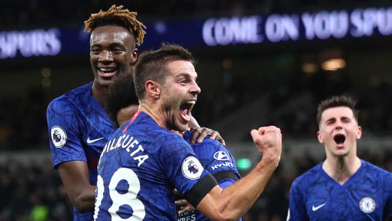 LONDON, ENGLAND - DECEMBER 22: Willian of Chelsea (hidden) celebrates after scoring his side's second goal with Cesar Azpilicueta and team mates during the Premier League match between Tottenham Hotspur and Chelsea FC at Tottenham Hotspur Stadium on December 22, 2019 in London, United Kingdom