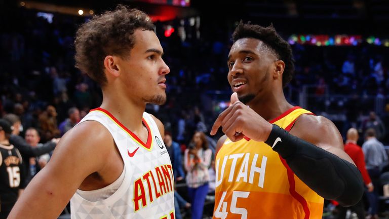 Donovan Mitchell shares a word with Trae Young