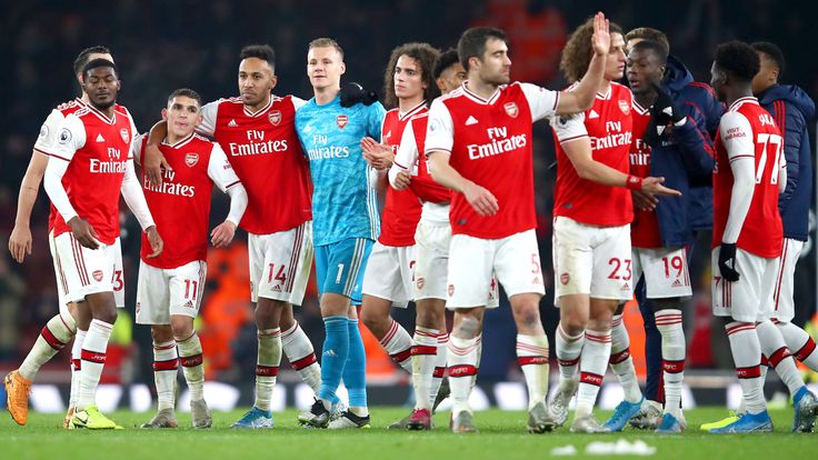 Arsenal players celebrate their win over Manchester United