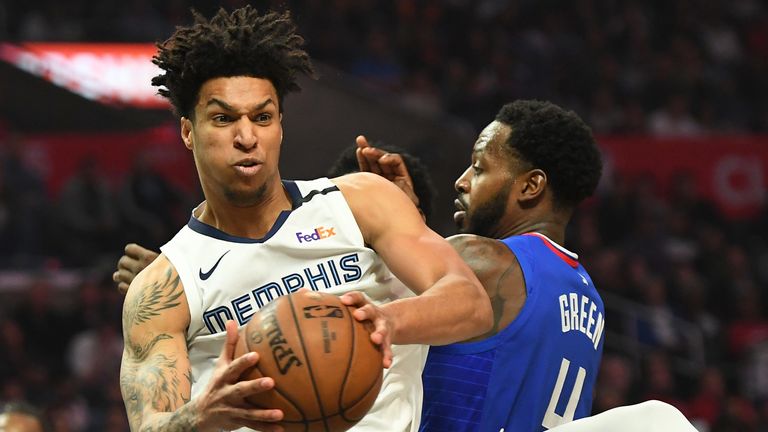 Grizzlies rookie Brandon Clarke snares a rebound against the Clippers