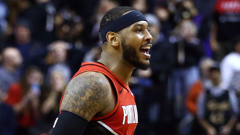 Carmelo Anthony reacts after sinking a game-winning shot against the Toronto Raptors