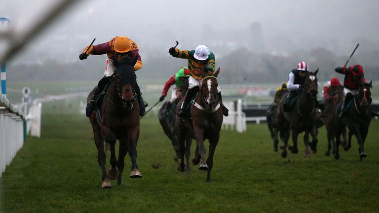 Israel Champ ridden by Tom Scudamore (left) on their way to winning at Cheltenham