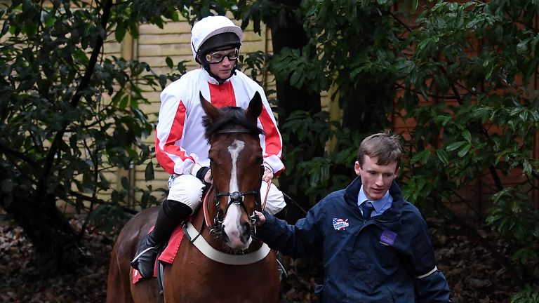 Goshen ridden by Jamie Moore heads out to the track at Sandown