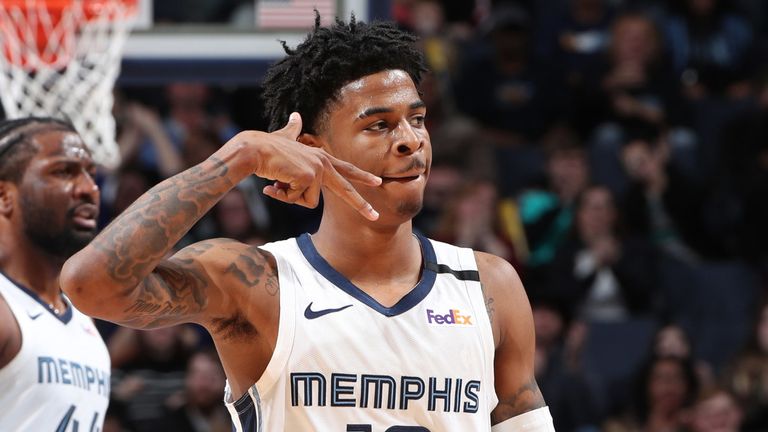 Ja Morant celebrates a successful three-pointer in Memphis&#39; win against Minnesota