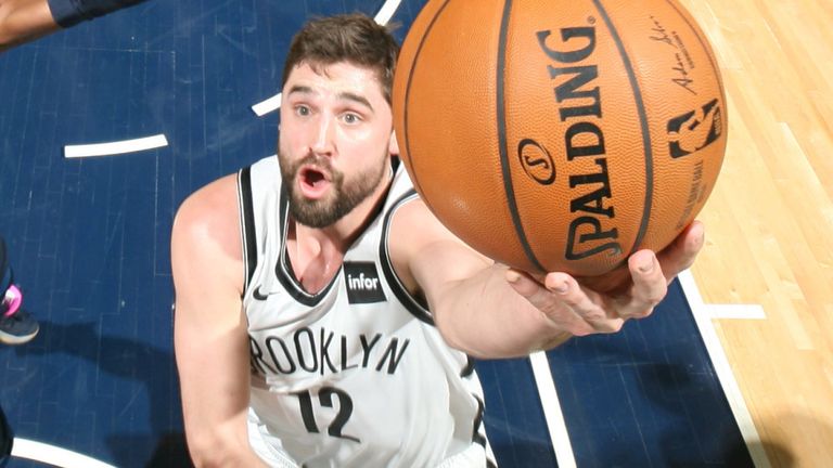 Joe Harris scores at the rim against Minnesota