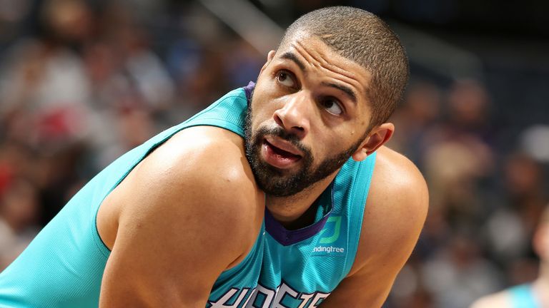 Nic Batum looks over his shoulder during a Hornets game