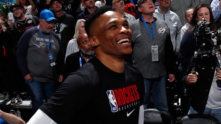 Russell Westbrook smiles as he watches a video tribute prior to Houston&#39;s game at Oklahoma City