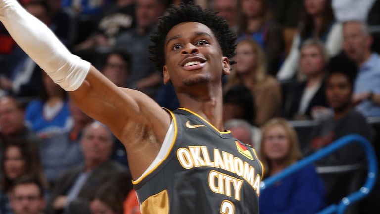 Shai Gilgeous-Alexander lofts a three-pointer in the Oklahoma City Thunder's win over the Houston Rockets