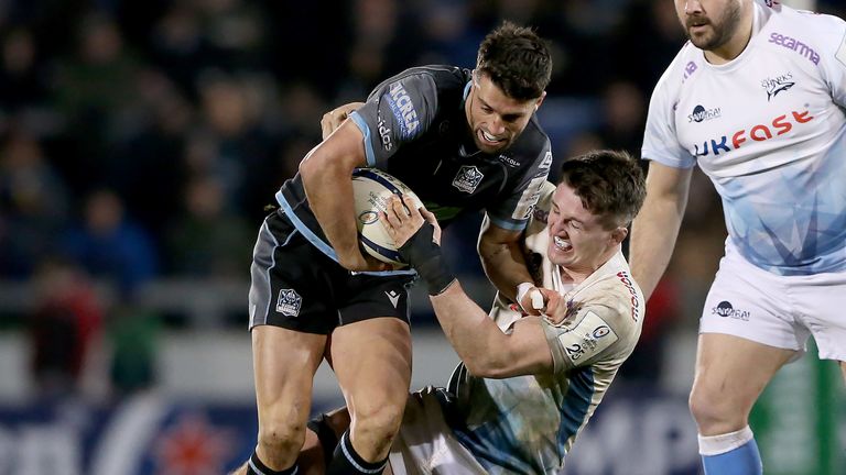 Glasgow's Adam Hastings is tackled by Tom Curry of Sale