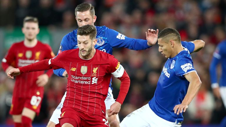 Adam Lallana holds off Gylfi Sigurdsson and Richarlison