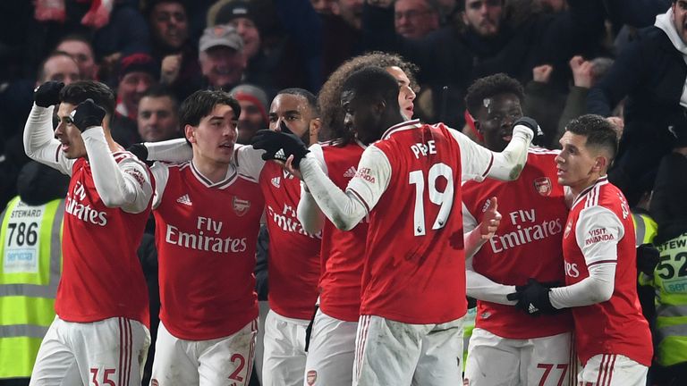 Arsenal celebrate Martinelli's equaliser at Stamford Bridge