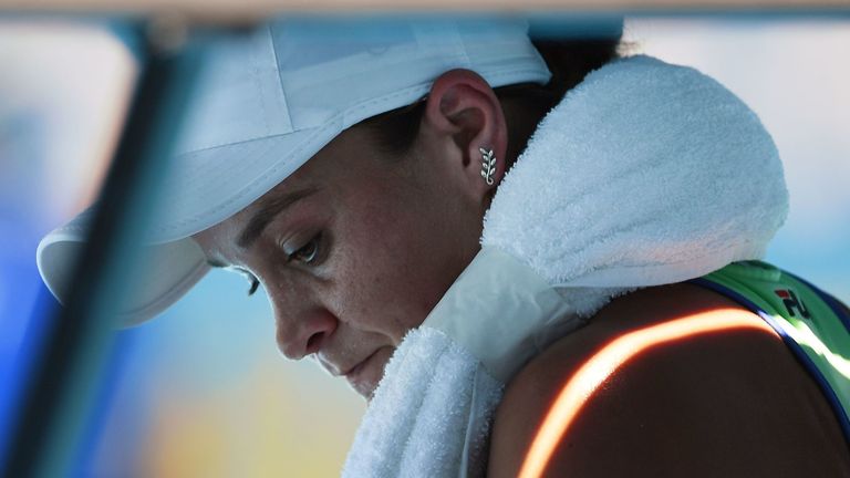 Australia's Ashleigh Barty uses an ice pack as she plays against Sofia Kenin of the US during their women's singles semi-final match on day eleven of the Australian Open tennis tournament in Melbourne on January 30, 2020.