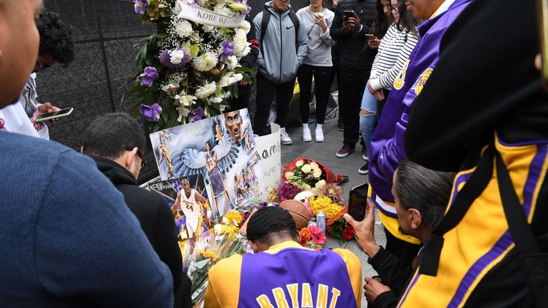 Flowers and tributes are left at a makeshift memorial for former NBA player Kobe Bryant outside the 62nd Annual GRAMMY Awards at STAPLES Center on January 26, 2020