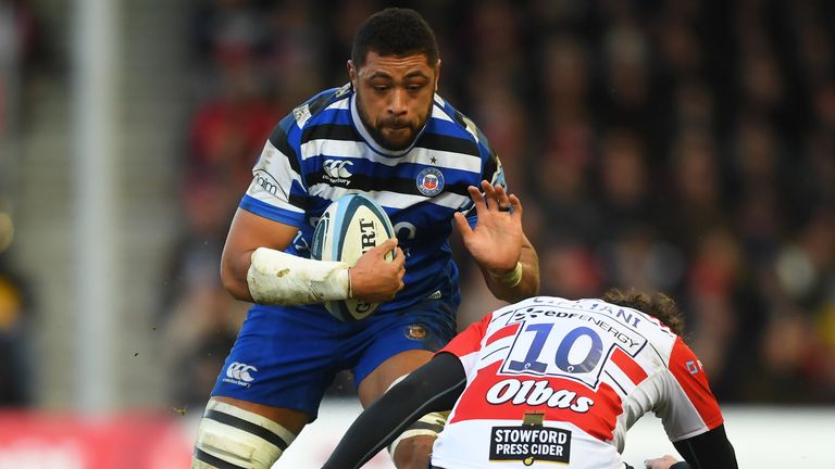 Taulupe Faletau is tackled by Tom Marshall