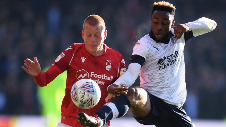 NOTTINGHAM, ENGLAND - JANUARY 19: Ben Watson of Nottingham Forest is tackled by Kazenga LuaLua of Luton Town during the Sky Bet Championship match between Nottingham Forest and Luton Town at the City Ground on January 19, 2020 in Nottingham, England. (Photo by Laurence Griffiths/Getty Images)