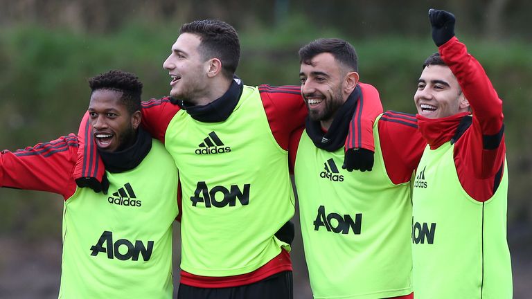 Bruno Fernandes with Manchester United team-mates, Fred, Diogo Dalot and Andreas Pereira during his first training session at Carrington