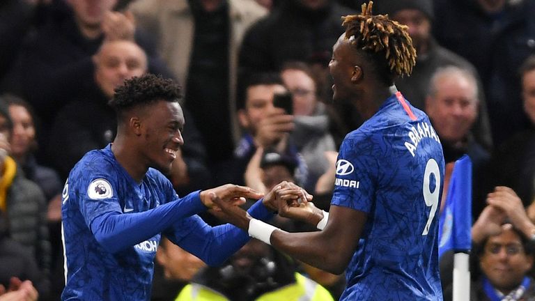 Callum Hudson-Odoi celebrates with team-mate Tammy Abraham after scoring Chelsea's third goal