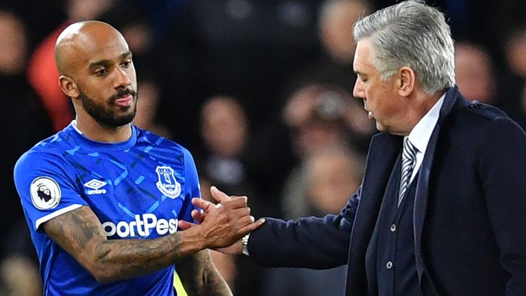 Everton boss Carlo Ancelotti shakes hands with midfielder Fabian Delph