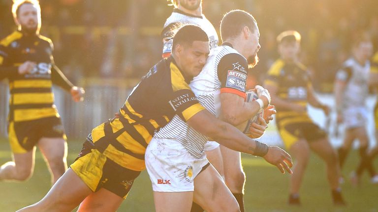 CASTLEFORD, ENGLAND - JANUARY 19: Peter Mata'utia of Castleford Tigers tackles Blake Wallace of Toronto Wolfpack during the Michael Shenton testimonial between Castleford Tigers and Toronto Wolfpack on January 19, 2020 in Castleford, England. (Photo by George Wood/Getty Images)