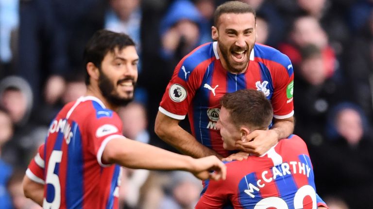 Cenk Tosun celebrates his goal against Man City