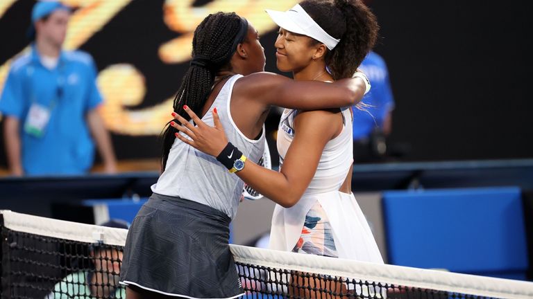 Coco Gauff of the US hugs Japan's Naomi Osaka (R) after their women's singles match on day five of the Australian Open tennis tournament in Melbourne on January 24, 2020. 