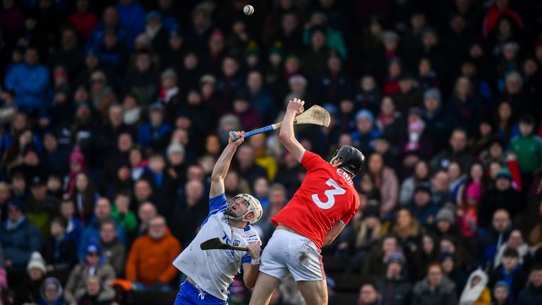 Dessie Hutchinson of Waterford and Robert Downey of Cork compete for possession