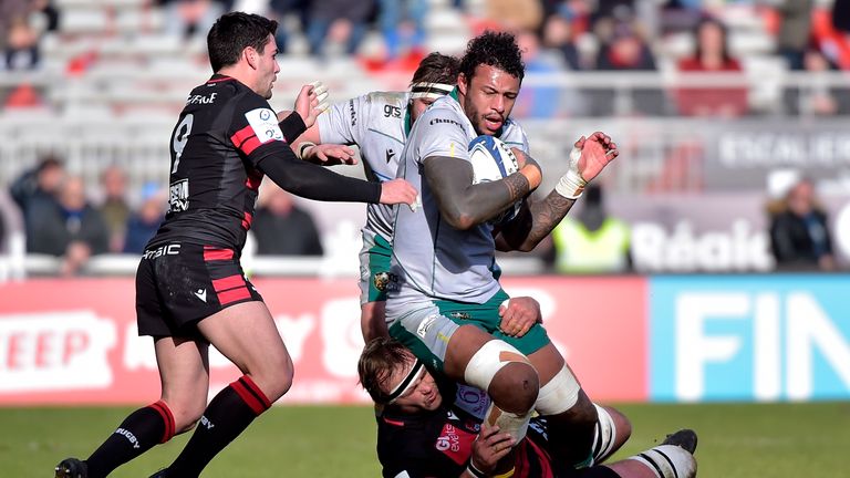 Courtney Lawes is tackled by Hendrick Roodt