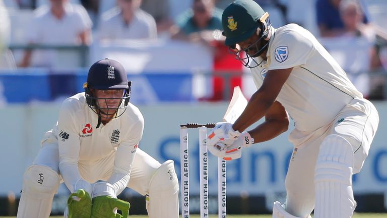 England wicketkeeper Jos Buttler looks on as South Africa's Vernon Philander shapes to drive during the second Test at Cape Town
