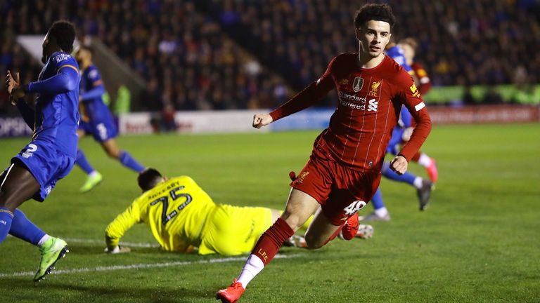 Curtis Jones wheels away after putting Liverpool ahead at Shrewsbury