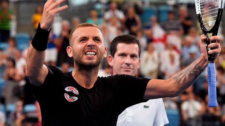 Dan Evans of Britain celebrates victory in front of team captain Tim Henman after his men's singles match against Alex de Minaur of Australia at the ATP Cup tennis tournament in Sydney on January 9, 2020