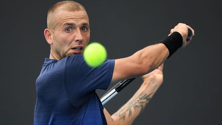 Britain's Dan Evans hits a return against Japan's Yoshihito Nishioka during their men's singles match on day three of the Australian Open tennis tournament in Melbourne on January 22, 2020.