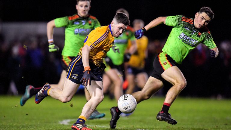 David Garland of DCU Dóchas Éireann in action against Richard Hitchcock of IT Carlow
