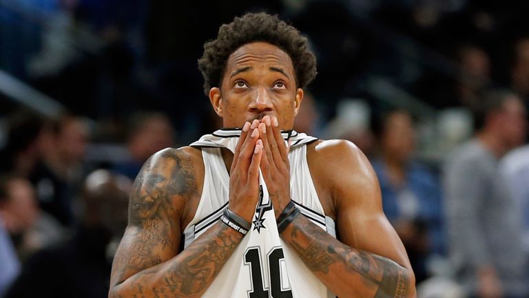 DeMar DeRozan checks the game clock during the Spurs' win over the Jazz