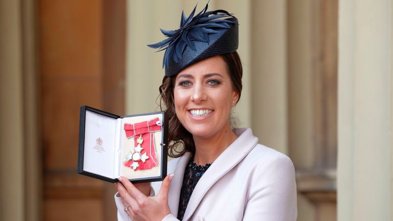 British dressage rider Charlotte Dujardin poses with her medal after she was appointed a Commander of the Order of the British Empire (CBE) For services to equestrianism during an Investiture ceremony at Buckingham Palace, London, on March 7, 2017. / AFP PHOTO / POOL / Yui Mok (Photo credit should read YUI MOK/AFP via Getty Images)