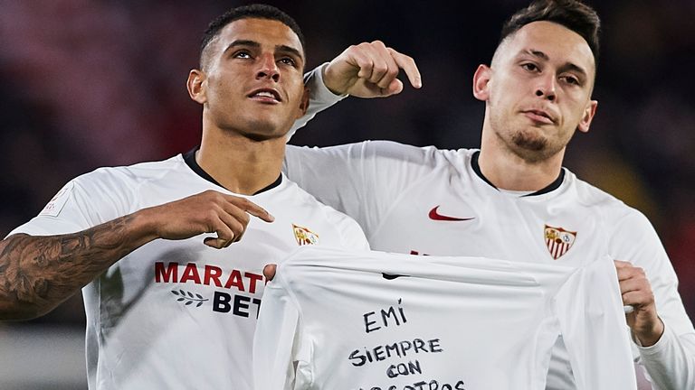 Lucas Ocampos and Diego Carlos Santos Silva of Sevilla FC hold a shirt in tribute to Emiliano Sala during the Copa del Rey match between Sevilla FC and Levante UD at Estadio Ramon Sanchez Pizjuan on January 21, 2020 in Seville, Spain.
