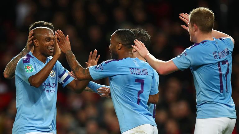 Fernandinho and Raheem Sterling celebrate Manchester City's third goal against Manchester United