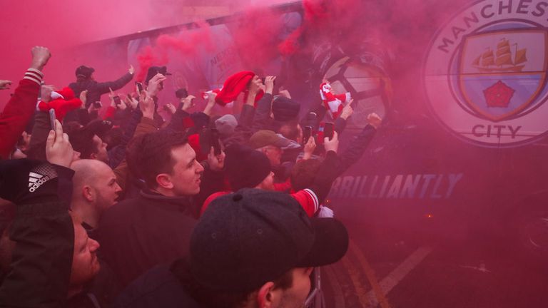 Liverpool fans "greet" the Manchester City bus ahead of the Champions League quarter-final in 2018