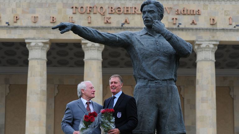 West Germany World Cup final goalkeeper Hans Tilkowski and England striker Geoff Hurst at statue of Tofiq Bahramov in Baku