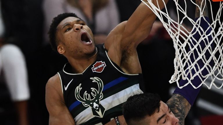 Giannis rises high above his defender for a slam dunk during the NBA Paris Game