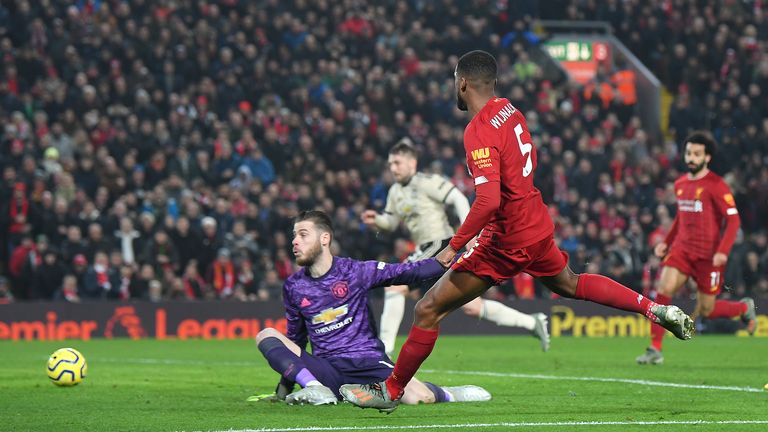 Liverpool's Gini Wijnaldum slots the ball beyond Manchester United's David de Gea only to see the goal ruled out for offside