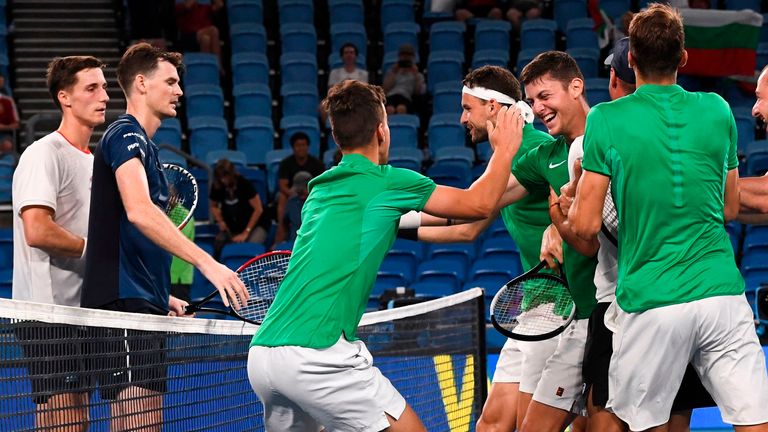 Grigor Dimitrov (3L) and Alexandar Lazarov (C-R) of Bulgaria celebrate with teammates after winning their men's doubles match against Jamie Murray and Joe Salisbury of Britain (L) at the ATP Cup tennis tournament in Sydney on January 4, 2020.