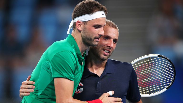 Grigor Dimitrov of Bulgaria embraces Dan Evans of Great Britain after winning their Group C singles match during day one of the 2020 ATP Cup Group Stage at Ken Rosewall Arena on January 03, 2020 in Sydney, Australia.