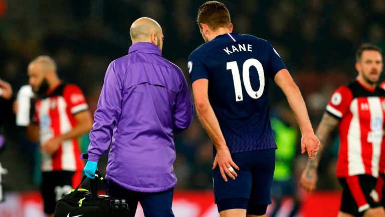 Harry Kane leaves the pitch after picking up an injury