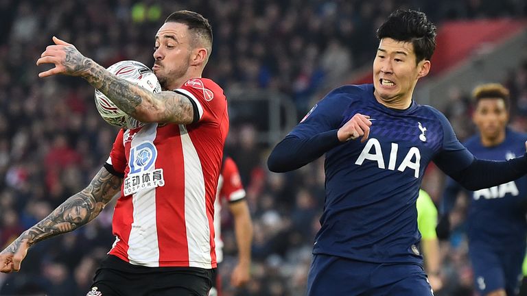 Danny Ings (L) controls the ball in front of Heung-Min Son 