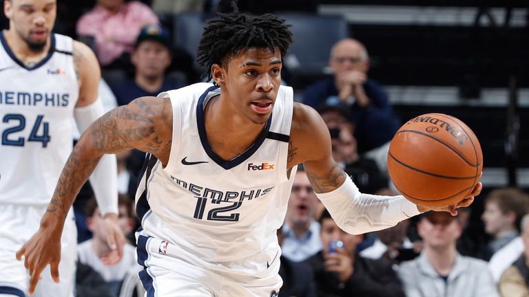 Ja Morant dribbles upcourt in Memphis' win over Denver