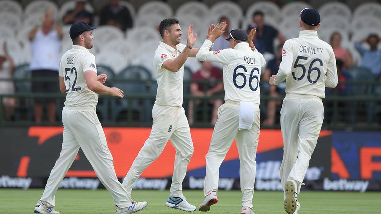 England bowler James Anderson is congratulated by team mates after taking the wicket of South Africa batsman Hamza during Day Four of the Second Test between South Africa and England at Newlands on January 06, 2020 in Cape Town, South Africa.