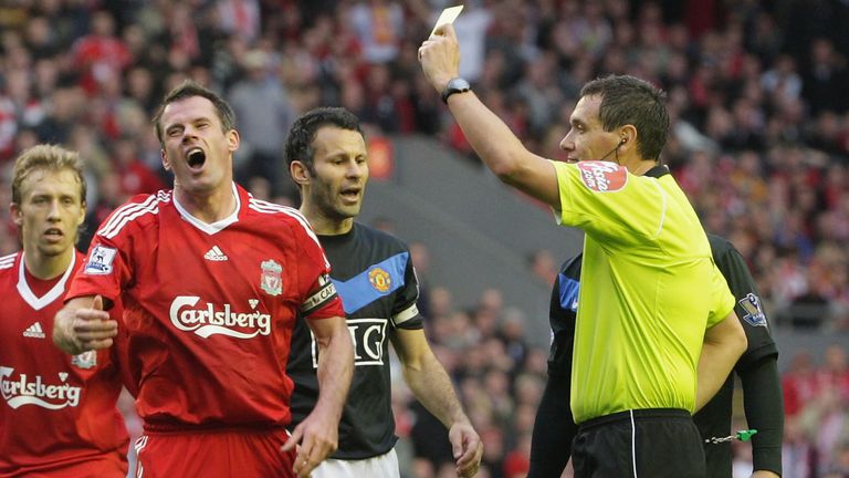 LIVERPOOL, ENGLAND - OCTOBER 25: Jamie Carragher of Liverpool is booked by referee Andre Marriner during the FA Barclays Premier League match between Liverpool and Manchester United at Anfield on October 25 2009 in Liverpool, England. (Photo by Matthew Peters/Manchester United via Getty Images) *** Local Caption *** Jamie Carragher;Andre Marriner