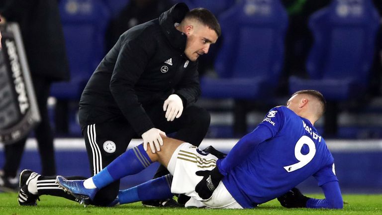 Jamie Vardy receives treatment before being substituted with an injury