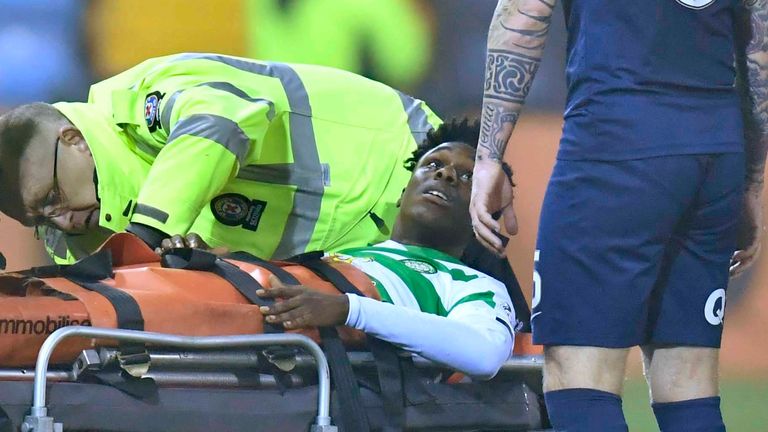 Celtic’s Jeremie Frimpong (left) exchanges words with Kilmarnock&#39;s Alan Power as he is stretchered off at Rugby Park