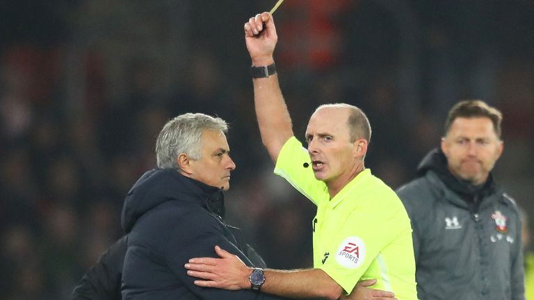 Mike Dean booked Jose Mourinho after his confrontation with the Tottenham coaching staff